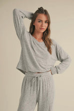 Load image into Gallery viewer, Woman wearing a gray loungewear set against a beige background