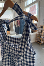 Load image into Gallery viewer, Blue and white checkered dress on a mannequin in a store setting
