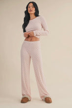 Load image into Gallery viewer, Woman wearing a patterned pajama set on a beige background