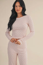 Load image into Gallery viewer, Woman wearing a pink polka dot long-sleeve top and pants on a beige background