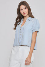 Load image into Gallery viewer, Woman wearing a light blue denim shirt against a plain background