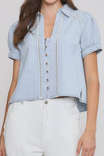 Load image into Gallery viewer, Light blue denim shirt with white pants on a plain background