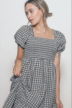 Load image into Gallery viewer, Woman wearing a checkered dress with puffed sleeves against a plain background