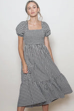 Load image into Gallery viewer, Woman wearing a checkered dress against a plain background