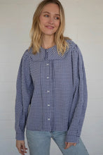 Load image into Gallery viewer, Woman wearing a blue and white checkered shirt against a plain background