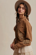 Load image into Gallery viewer, Woman wearing a brown embroidered jacket and hat against a beige background