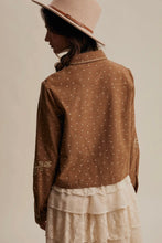 Load image into Gallery viewer, Person wearing a brown patterned shirt and beige hat on a plain background