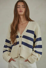 Load image into Gallery viewer, Woman wearing a cream and navy striped cardigan against a plain background