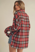 Load image into Gallery viewer, Woman wearing a red and black plaid shirt with a beige background