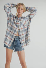 Load image into Gallery viewer, Woman wearing a plaid shirt and denim shorts on a white background