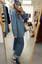 Load image into Gallery viewer, Person wearing a denim outfit in a clothing store.