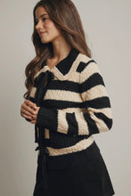 Load image into Gallery viewer, Woman wearing a black and beige striped sweater against a plain background
