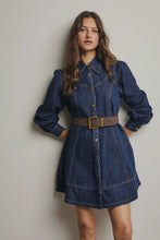 Load image into Gallery viewer, Woman wearing a blue denim dress with a belt against a plain background