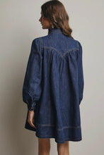 Load image into Gallery viewer, Woman wearing a blue denim dress against a plain background