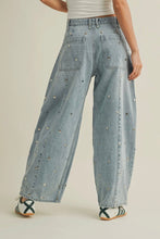 Load image into Gallery viewer, Light blue denim wide-leg pants worn by a person on a beige background