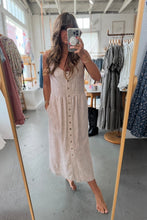 Load image into Gallery viewer, Woman taking a mirror selfie wearing a beige dress in a clothing store.