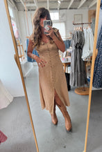 Load image into Gallery viewer, Woman taking a mirror selfie wearing a brown dress in a clothing store.