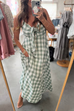 Load image into Gallery viewer, Person wearing a green and white checkered dress in a clothing store.