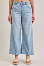 Load image into Gallery viewer, Light blue wide-leg jeans worn by a person on a plain background