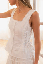 Load image into Gallery viewer, Woman wearing a light-colored sleeveless top with lace details.
