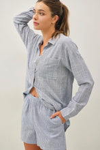 Load image into Gallery viewer, Woman wearing a gray striped pajama set against a plain background
