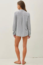 Load image into Gallery viewer, Woman wearing a light gray button-up shirt on a white background