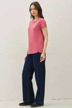 Load image into Gallery viewer, Woman wearing a pink shirt and blue pants against a white background