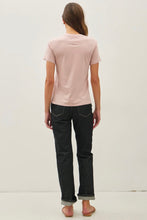 Load image into Gallery viewer, Person wearing a light pink t-shirt and black jeans on a white background
