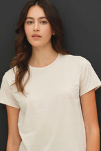 Load image into Gallery viewer, Woman wearing a plain white t-shirt against a dark background