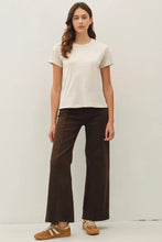 Load image into Gallery viewer, Woman wearing a white t-shirt and brown pants on a plain background