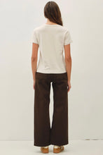Load image into Gallery viewer, Person wearing a white t-shirt and brown pants on a plain background