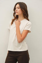 Load image into Gallery viewer, Woman wearing a white t-shirt and brown pants against a plain background