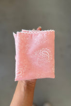 Load image into Gallery viewer, Pink embroidered fabric held against a gray background