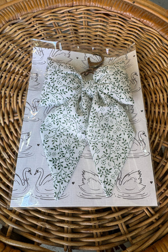Packaged fabric with a floral pattern on a woven surface
