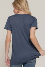 Load image into Gallery viewer, Woman wearing a blue t-shirt with a plain background