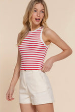 Load image into Gallery viewer, Woman wearing a red and white striped tank top and white shorts on a beige background