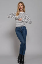 Load image into Gallery viewer, Woman wearing a striped shirt and blue jeans against a gray background