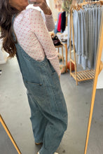Load image into Gallery viewer, Person wearing denim overalls in a store setting